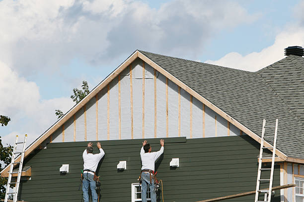 Professional Storm Damage Siding Repair technician working in Staunton, IL